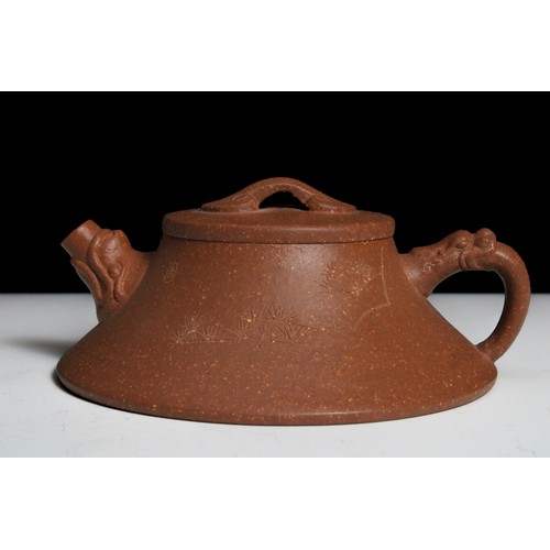 340 - A Chinese Yixing Zisha Flat Teapot with Chinese Inscriptions with Character Marks to the Base.

H: A... 