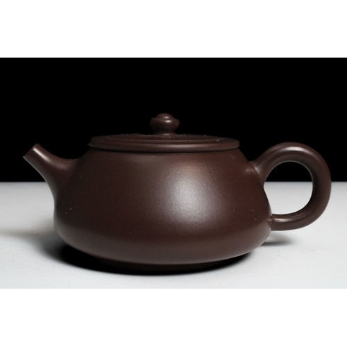 341 - A Chinese Yixing Zisha Teapot with Character Marks to the Base.

H: Approximately 7cm