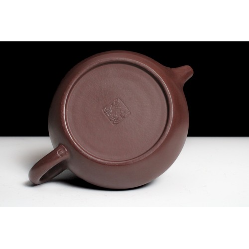 346 - A Chinese Yixing Zisha Flat Teapot with Character Marks to the Base.

H: Approximately 5cm