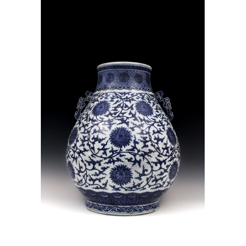 349 - A Chinese Blue & White Pear Shaped Vase with Archaic Pierced Handles from the Qing Dynasty with a Si...