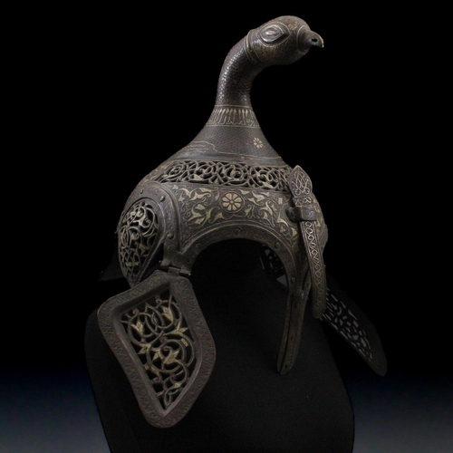 91 - An Indian Islamic Brass Helmet with Openwork in the Form of a Bird Decorated with Islamic Calligraph... 