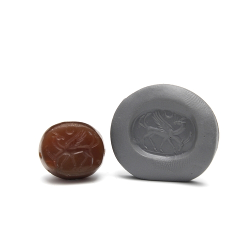 434 - A Greco-Persian Dark Red Agate Scarab Depicting Two Goats Walking with Half Moon.