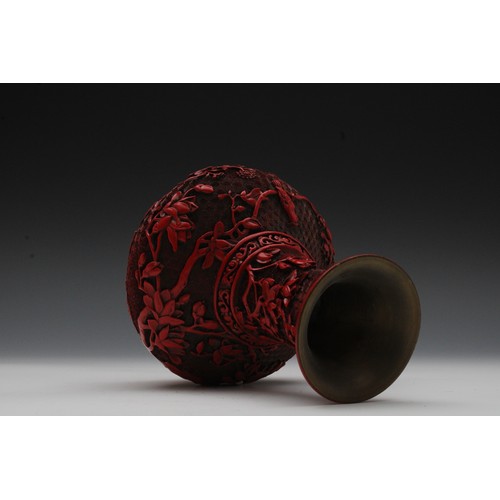 355 - A Chinese Cinnabar Lacquer Vase with a Wooden Base.

H with Stand: Approximately 21cm 
H: Approximat... 