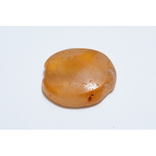 175 - A Greek Carnelian Scarab Gem Depicting a Dolphin.