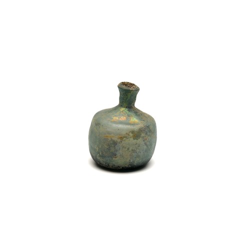 182 - An Islamic Light Green Glass Bottle with Lovely Patina from the 11-12th Century.

H: Approximately 8... 