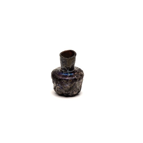 184 - An Islamic Dark Glass Bottle with Lovely Patina and Design from the 11-12th Century.

H: Approximate... 