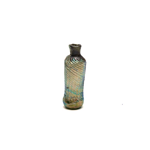 185 - An Islamic Glass Bottle with Lovely Rainbow Patina and Design from the 11-12th Century.

H: Approxim... 