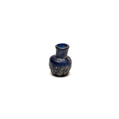 188 - An Islamic Small Blue Moulded Glass with Patina from the 11-12th Century.

H: Approximately 5cm