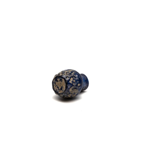 188 - An Islamic Small Blue Moulded Glass with Patina from the 11-12th Century.

H: Approximately 5cm