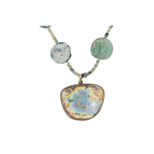 195 - A Silver and Roman Glass Bead Necklace with a Large Circular Pendant with Lovely Patina.

L: Approxi... 