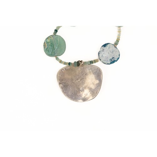 195 - A Silver and Roman Glass Bead Necklace with a Large Circular Pendant with Lovely Patina.

L: Approxi... 