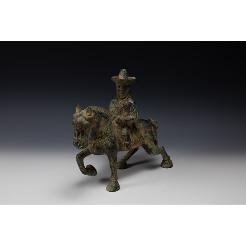 358 - A Chinese Bronze Figure of a Man Riding a Horse Possibly Tang Dynasty.

H: Approximately 31cm
L: App... 