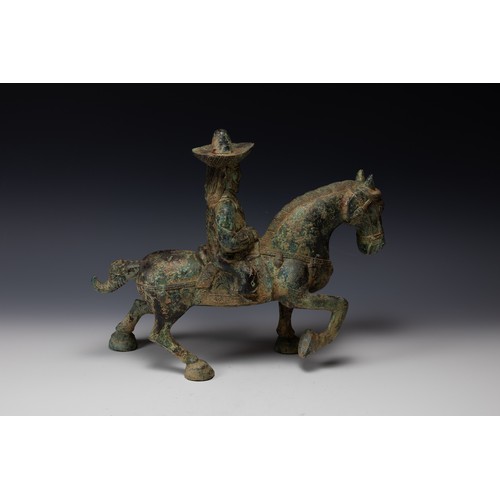 358 - A Chinese Bronze Figure of a Man Riding a Horse Possibly Tang Dynasty.

H: Approximately 31cm
L: App... 