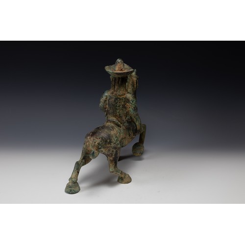 358 - A Chinese Bronze Figure of a Man Riding a Horse Possibly Tang Dynasty.

H: Approximately 31cm
L: App... 