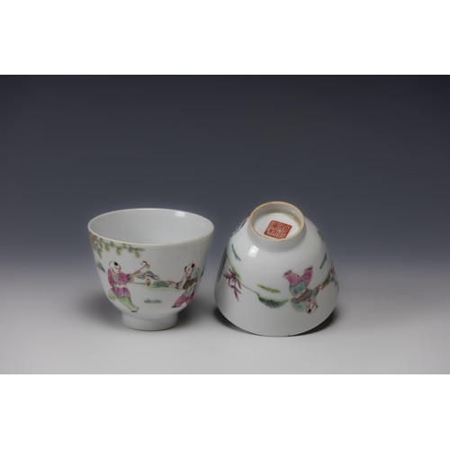 361 - A Pair of Chinese White Ground Famille Rose Porcelain Cups with Character Marks to the Base.

H: App... 