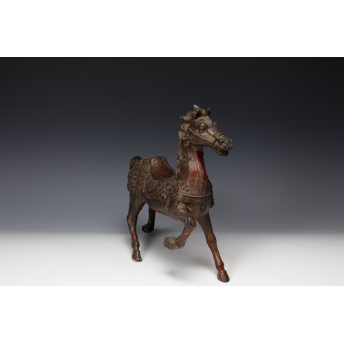 365 - A Chinese Bronze Gilted Figure of a Prancing Horse.

H: Approximately 29cm
L: Approximately 31cm