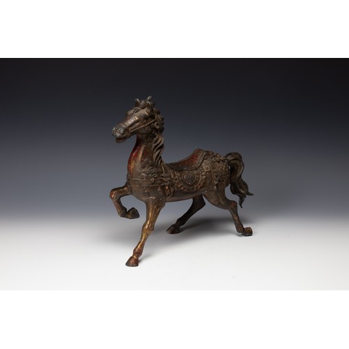 365 - A Chinese Bronze Gilted Figure of a Prancing Horse.

H: Approximately 29cm
L: Approximately 31cm