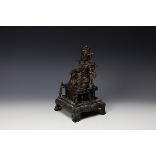 398 - A Tibetan Bronze Gilted Buddhist Seated Figure of Guan Yin.

H: Approximately 25cm