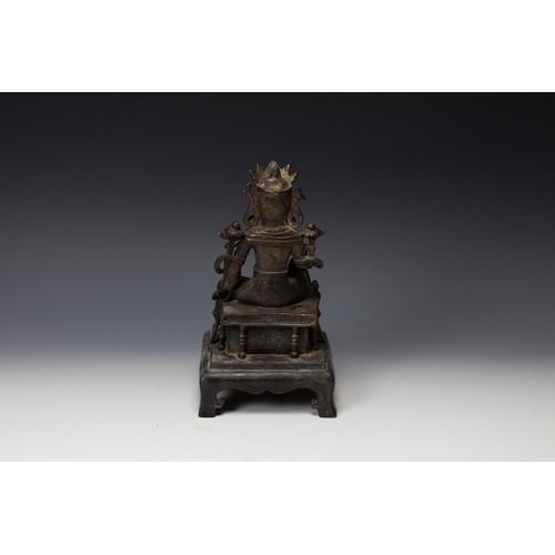 398 - A Tibetan Bronze Gilted Buddhist Seated Figure of Guan Yin.

H: Approximately 25cm