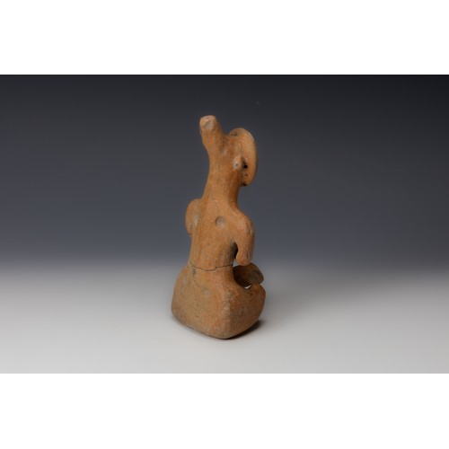 197 - A Late Minoan or Turkish Terracotta Figure of a Seated Idol from 600 B.C.

H: Approximately 18cm