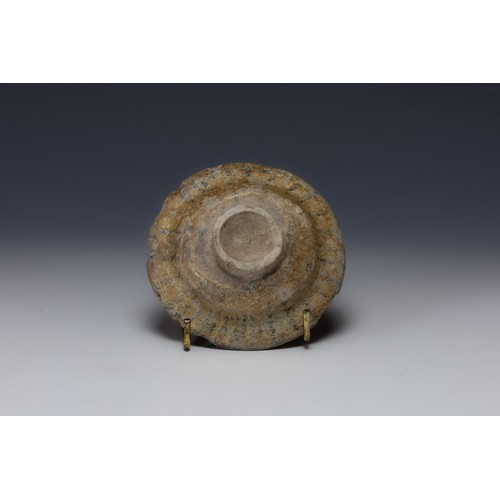 201 - A Raqqa Ceramic Well of Plates from the 13th Century.

D: Approximately 9.6cm