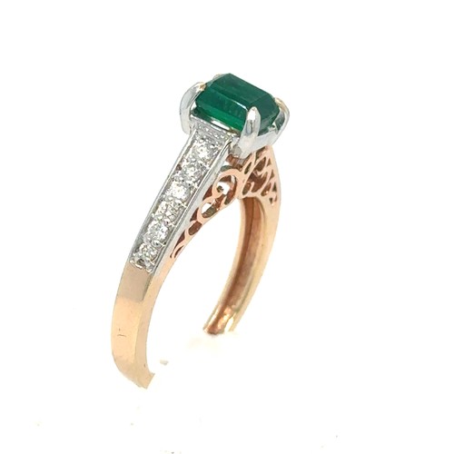 436 - An Emerald and Diamond Ring in Rose and White Gold.

Emerald Weight: Approximately 1ct
Stamped 14K 5... 