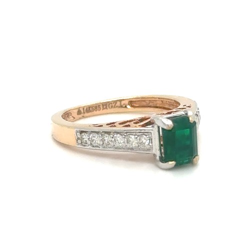 436 - An Emerald and Diamond Ring in Rose and White Gold.

Emerald Weight: Approximately 1ct
Stamped 14K 5... 