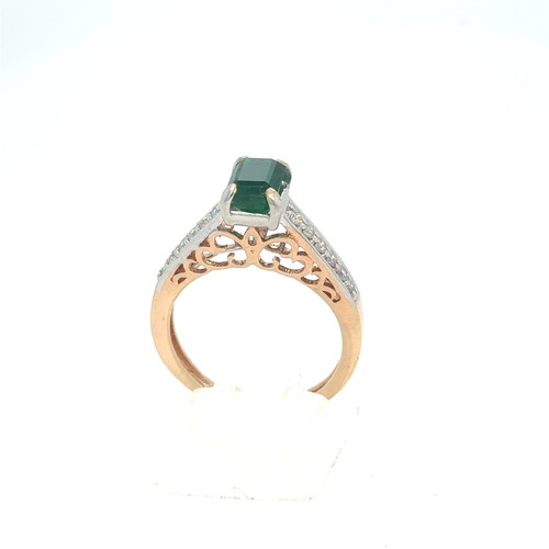 436 - An Emerald and Diamond Ring in Rose and White Gold.

Emerald Weight: Approximately 1ct
Stamped 14K 5... 