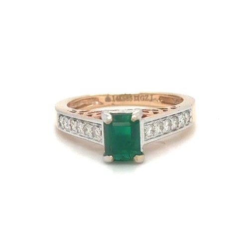 436 - An Emerald and Diamond Ring in Rose and White Gold.

Emerald Weight: Approximately 1ct
Stamped 14K 5... 