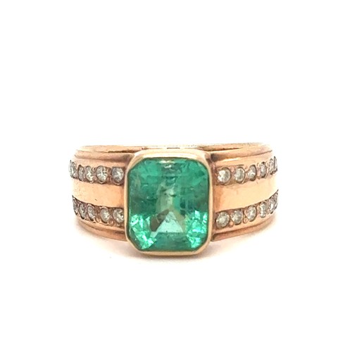 437 - An Emerald and Diamond Ring in Rose Gold.

Emerald Weight: Approximately 3.3ct
Stamped 14K
Ring Size... 