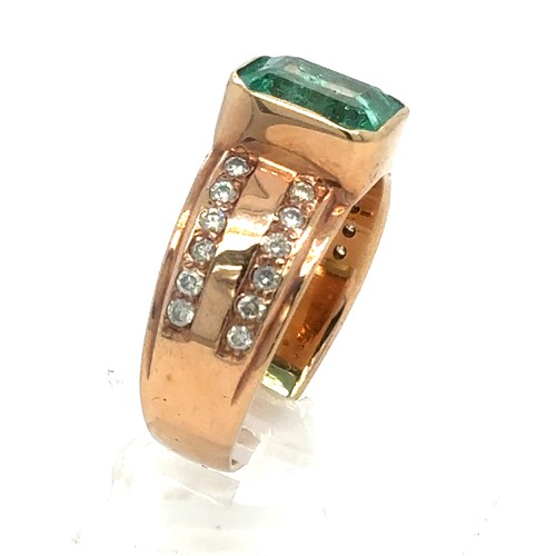 437 - An Emerald and Diamond Ring in Rose Gold.

Emerald Weight: Approximately 3.3ct
Stamped 14K
Ring Size... 