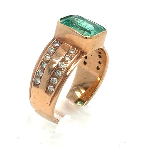 437 - An Emerald and Diamond Ring in Rose Gold.

Emerald Weight: Approximately 3.3ct
Stamped 14K
Ring Size... 