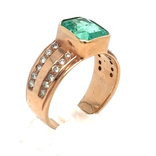 437 - An Emerald and Diamond Ring in Rose Gold.

Emerald Weight: Approximately 3.3ct
Stamped 14K
Ring Size... 