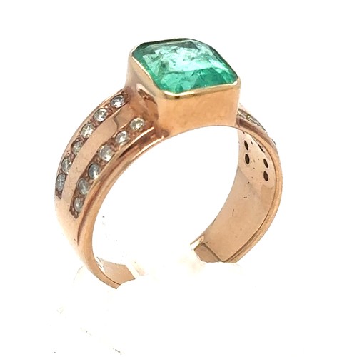 437 - An Emerald and Diamond Ring in Rose Gold.

Emerald Weight: Approximately 3.3ct
Stamped 14K
Ring Size... 