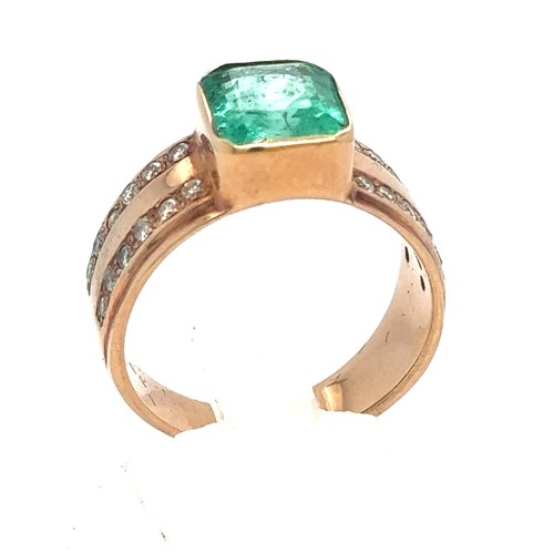 437 - An Emerald and Diamond Ring in Rose Gold.

Emerald Weight: Approximately 3.3ct
Stamped 14K
Ring Size... 