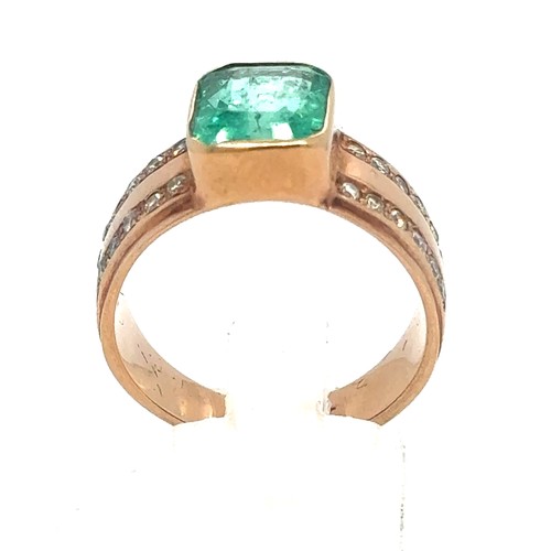 437 - An Emerald and Diamond Ring in Rose Gold.

Emerald Weight: Approximately 3.3ct
Stamped 14K
Ring Size... 