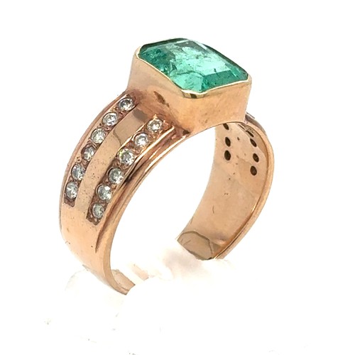 437 - An Emerald and Diamond Ring in Rose Gold.

Emerald Weight: Approximately 3.3ct
Stamped 14K
Ring Size... 