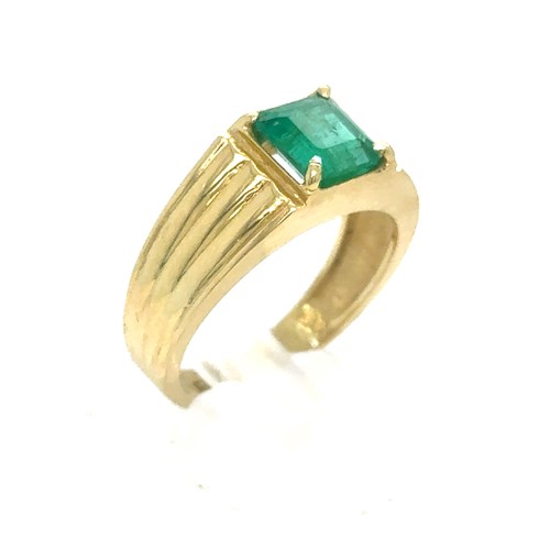 438 - An Emerald and Diamond Ring in Yellow Gold.

Emerald Weight: Approximately 1.75ct 
Stamped 18K
Ring ... 