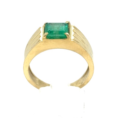 438 - An Emerald and Diamond Ring in Yellow Gold.

Emerald Weight: Approximately 1.75ct 
Stamped 18K
Ring ... 