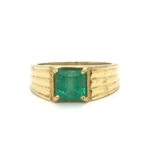 438 - An Emerald and Diamond Ring in Yellow Gold.

Emerald Weight: Approximately 1.75ct 
Stamped 18K
Ring ... 