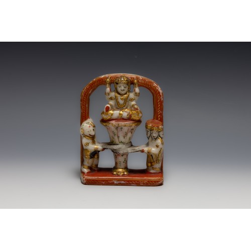 407 - An Indian Alabaster Figure of a Deity and 2 Mystical People Beside.

H: Approximately 13.8cm