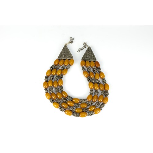 445 - A Large Tribal Yemeni White Metal and Amber Colour Beads Necklace with 4 Strings.

345g