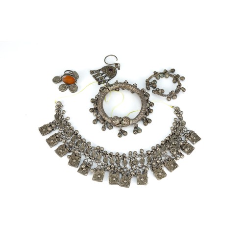 451 - A Lot of Tribal Yemeni Jewellery.

2 Silver Bracelets - 112g
1 White Metal Necklace - 158g
1 White M... 