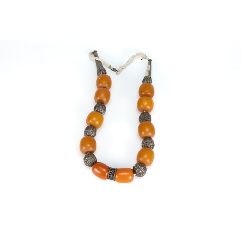 454 - A Tribal Yemeni White Metal Necklace with Amber Colour Beads.

196g