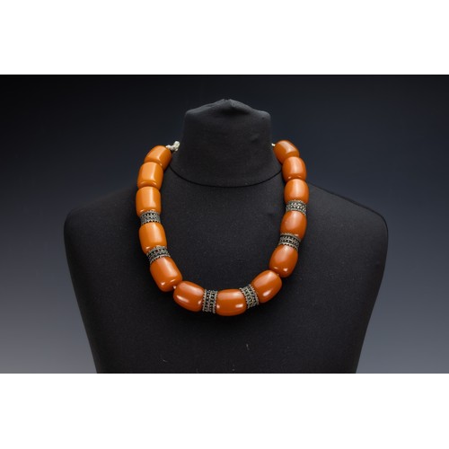 455 - A Tribal Yemeni White Metal Necklace with Amber Colour Beads.

226g