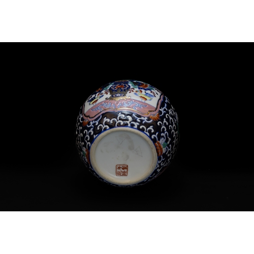 14 - A Chinese Porcelain Jar Depicting Floral Patterns with Character Marks on the Base.