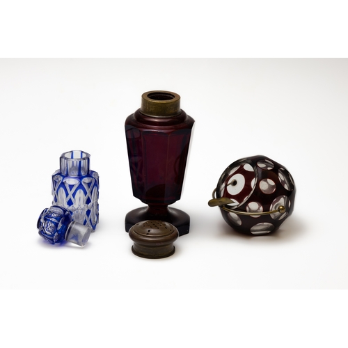 64 - A Lot of 3 Antique Bohemian Glass from the 19th Century.

Includes:

A Blue Scent Bottle
A Red Salt ... 