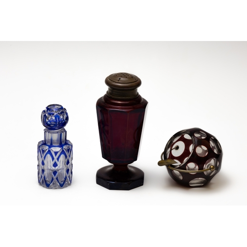 64 - A Lot of 3 Antique Bohemian Glass from the 19th Century.

Includes:

A Blue Scent Bottle
A Red Salt ... 