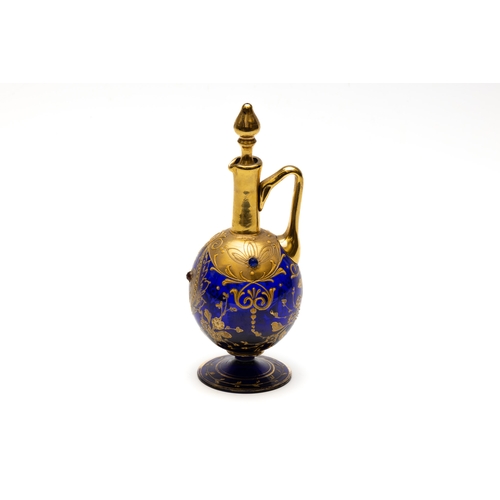 96 - A Vintage Bohemian Blue Glass Decanter from the Early 20th Century.

H: Approximately 21cm