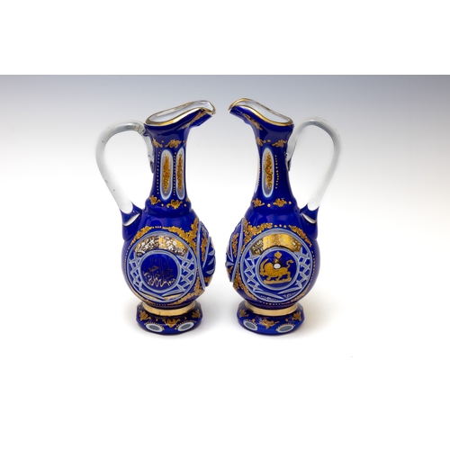 156 - A Pair of Large Bohemian Blue Glass Jugs Made for the Islamic Market.

H: Approximately 33cm